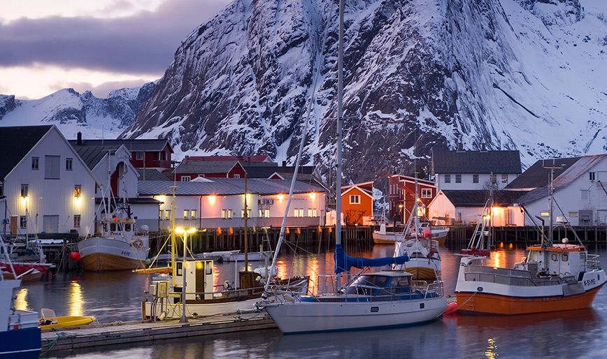 fishing-boats-moored-in-harbour-of-settlement-with-V2VWFMA