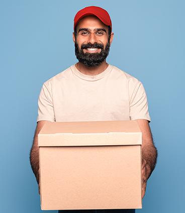 indian-delivery-man-in-uniform-holding-cardboard-b-E8GAW72